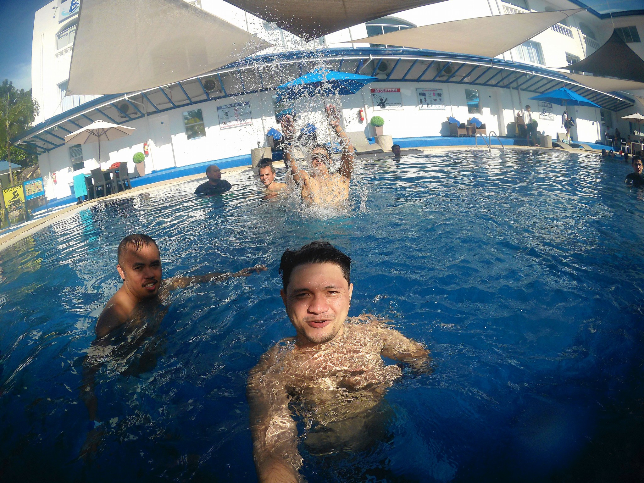 Innovuze employees having fun in the Blu Sands Resort's swimming pool